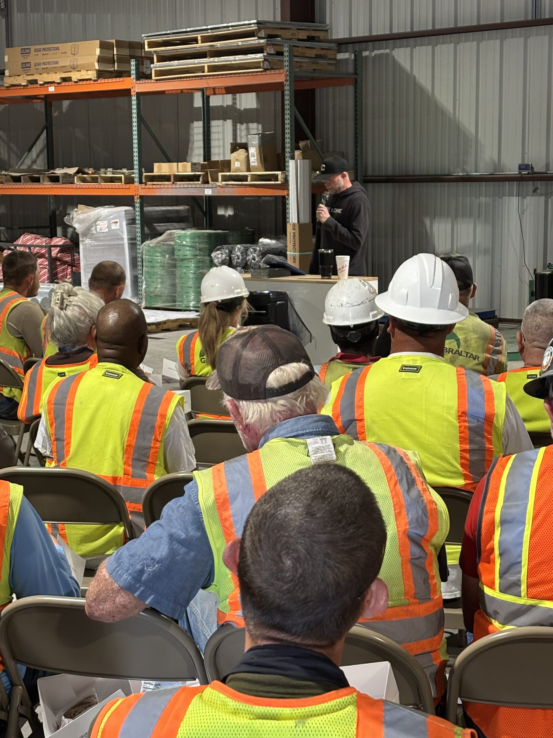 Matt Kelly delivering iron sharpens iron witness testimony to construction workers at Gibraltar shop Burnet Texas